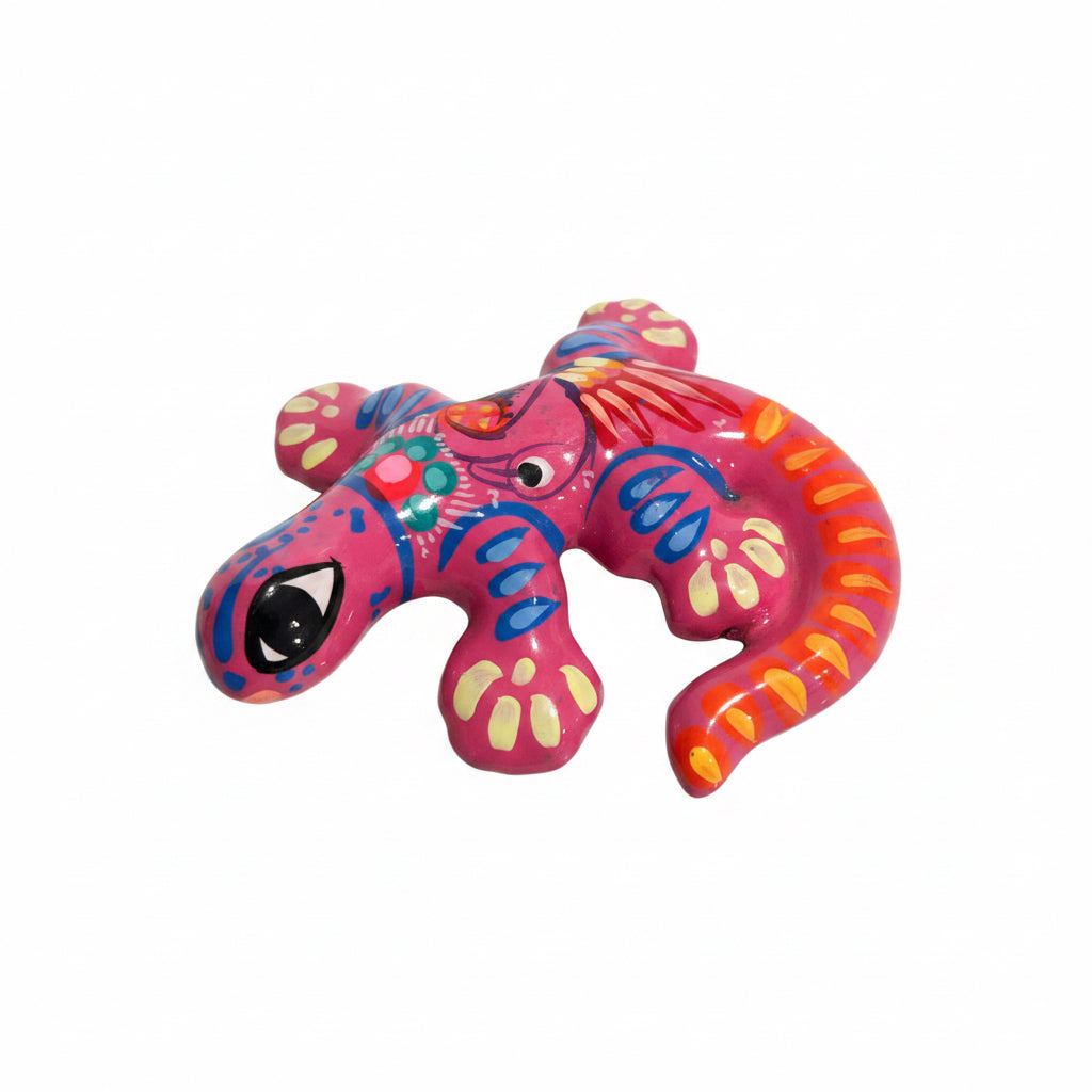 Colorful lizard-shaped object on a light surface