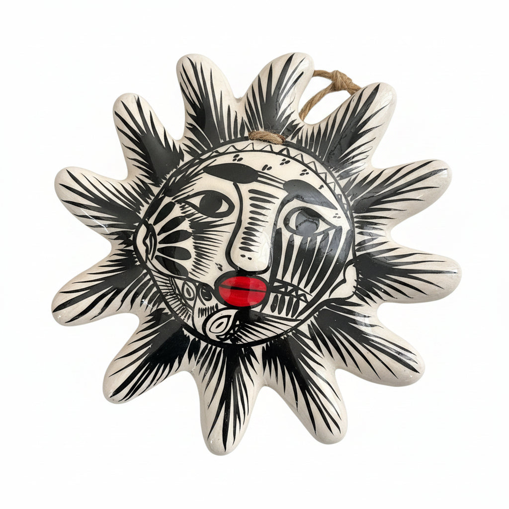 Colorful sun-shaped decorative item with a face design on a white background