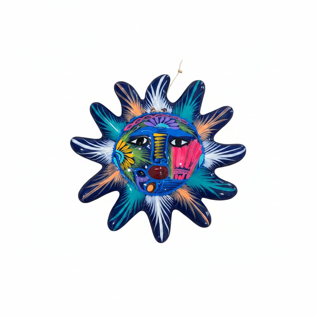 Colorful sun-shaped decorative item with a face design on a white background