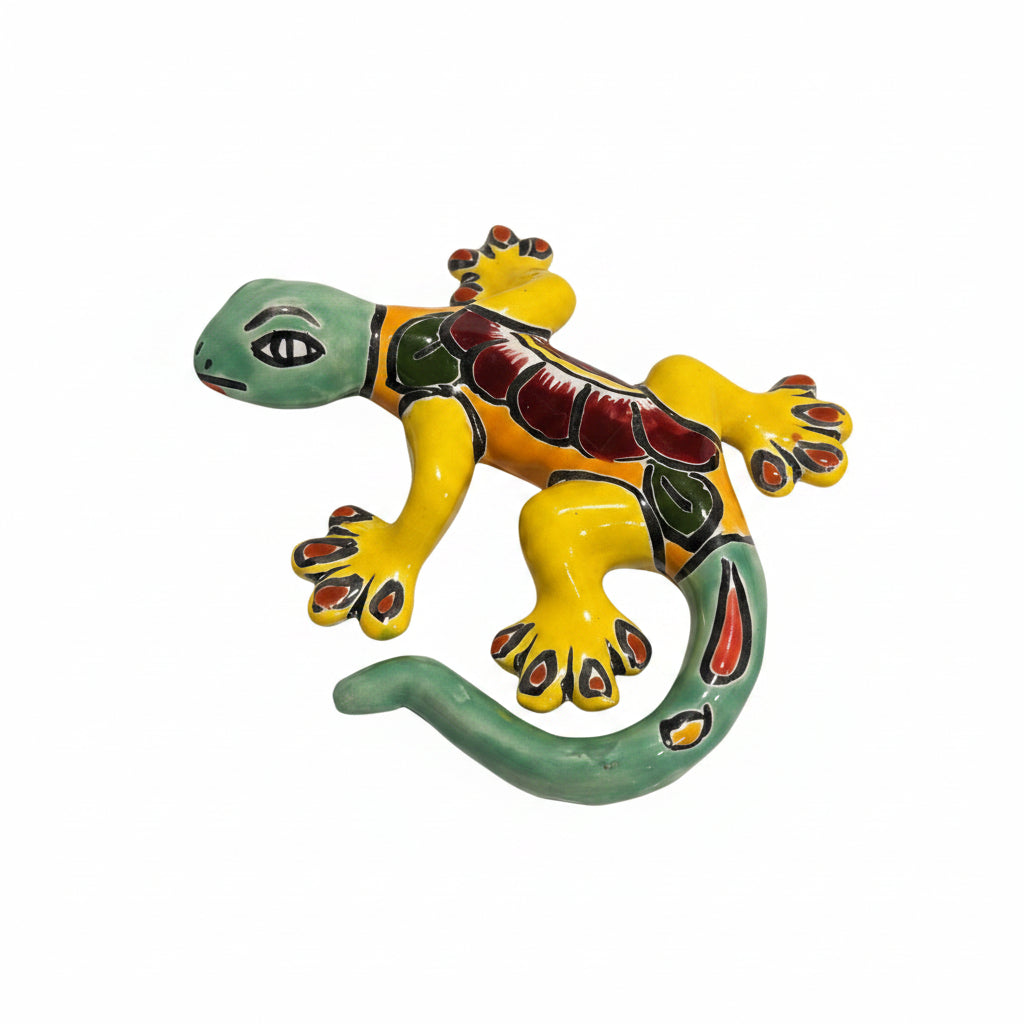 Colorful ceramic lizard on a light-colored surface