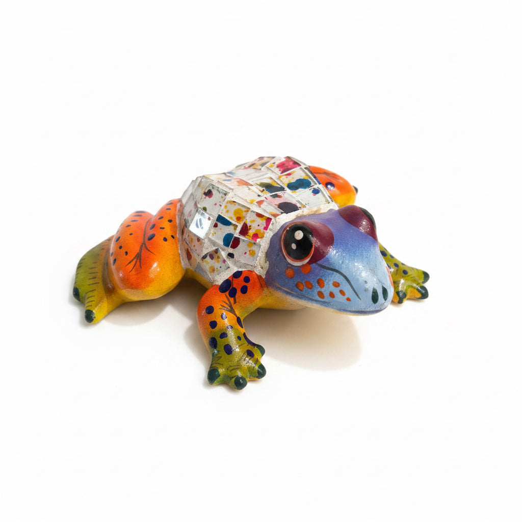Colorful frog figurine on a light-colored surface
