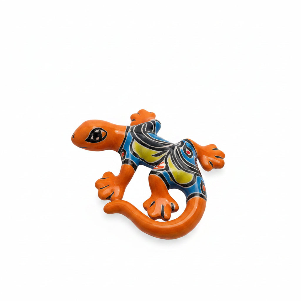 Decorative lizard wall art on a light-colored surface