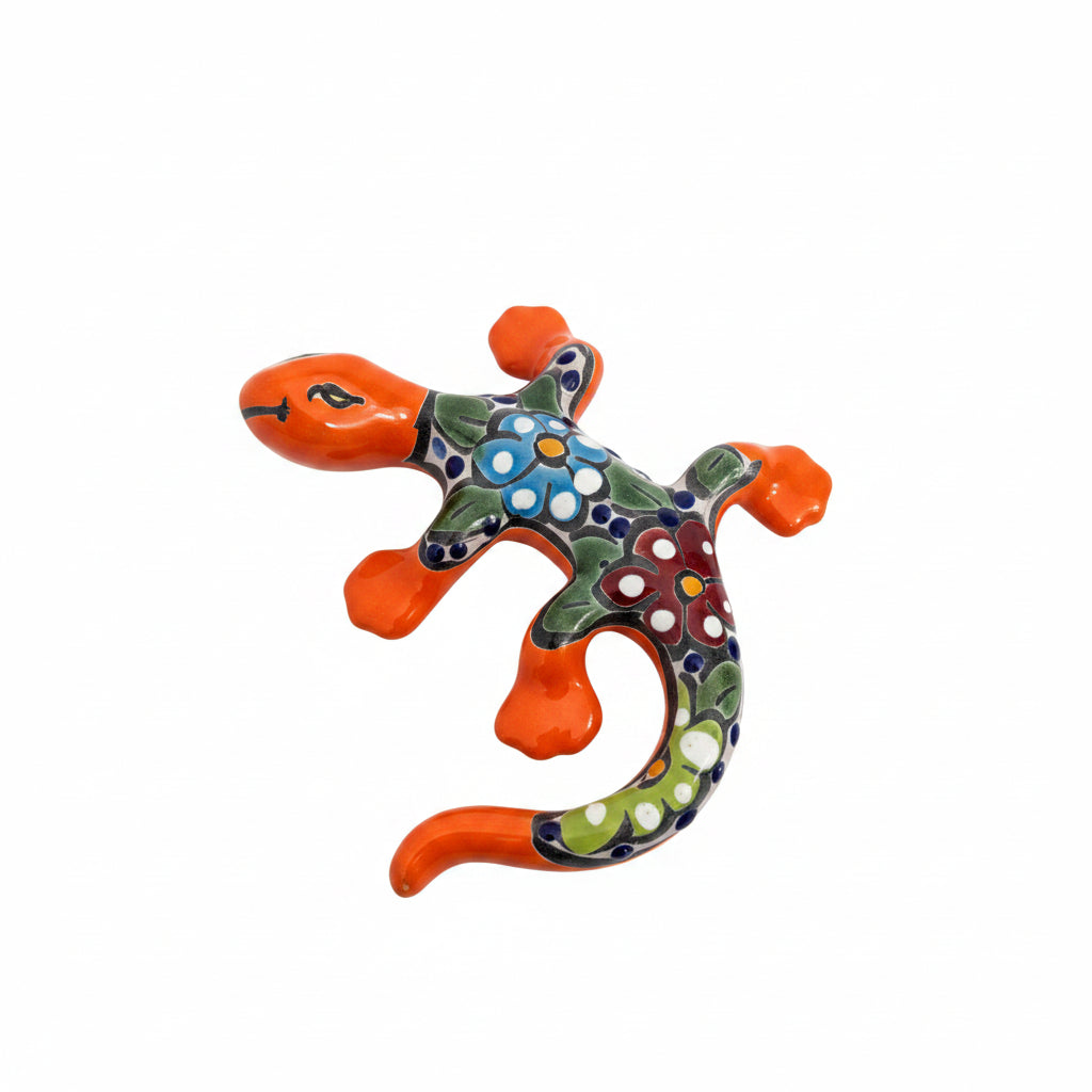 Colorful ceramic lizard figurines on a light-colored surface