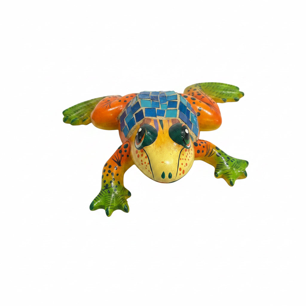 Colorful frog figurine on a white surface