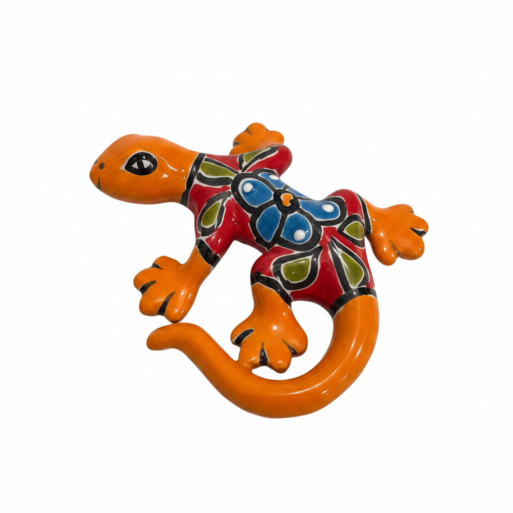 Colorful ceramic lizard figurine on a white background