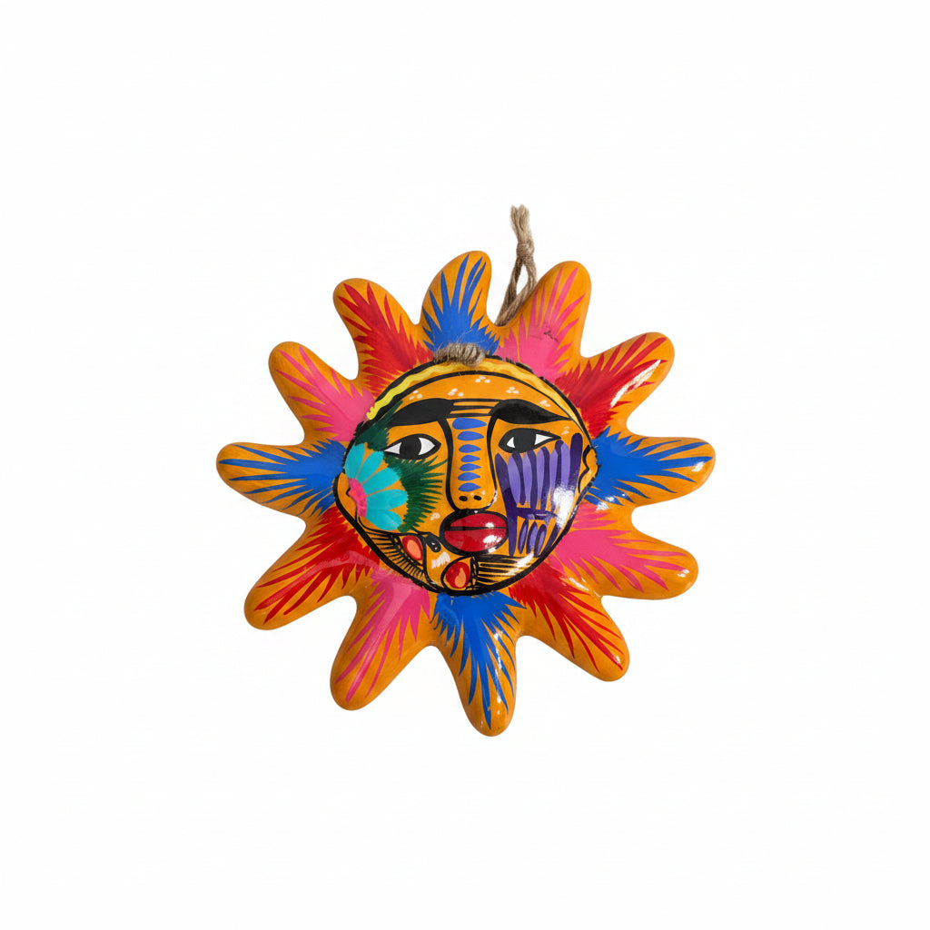 Colorful sun-shaped decorative item with a face design on a white background